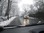 SX17028 Cars driving through snow on country lane.jpg